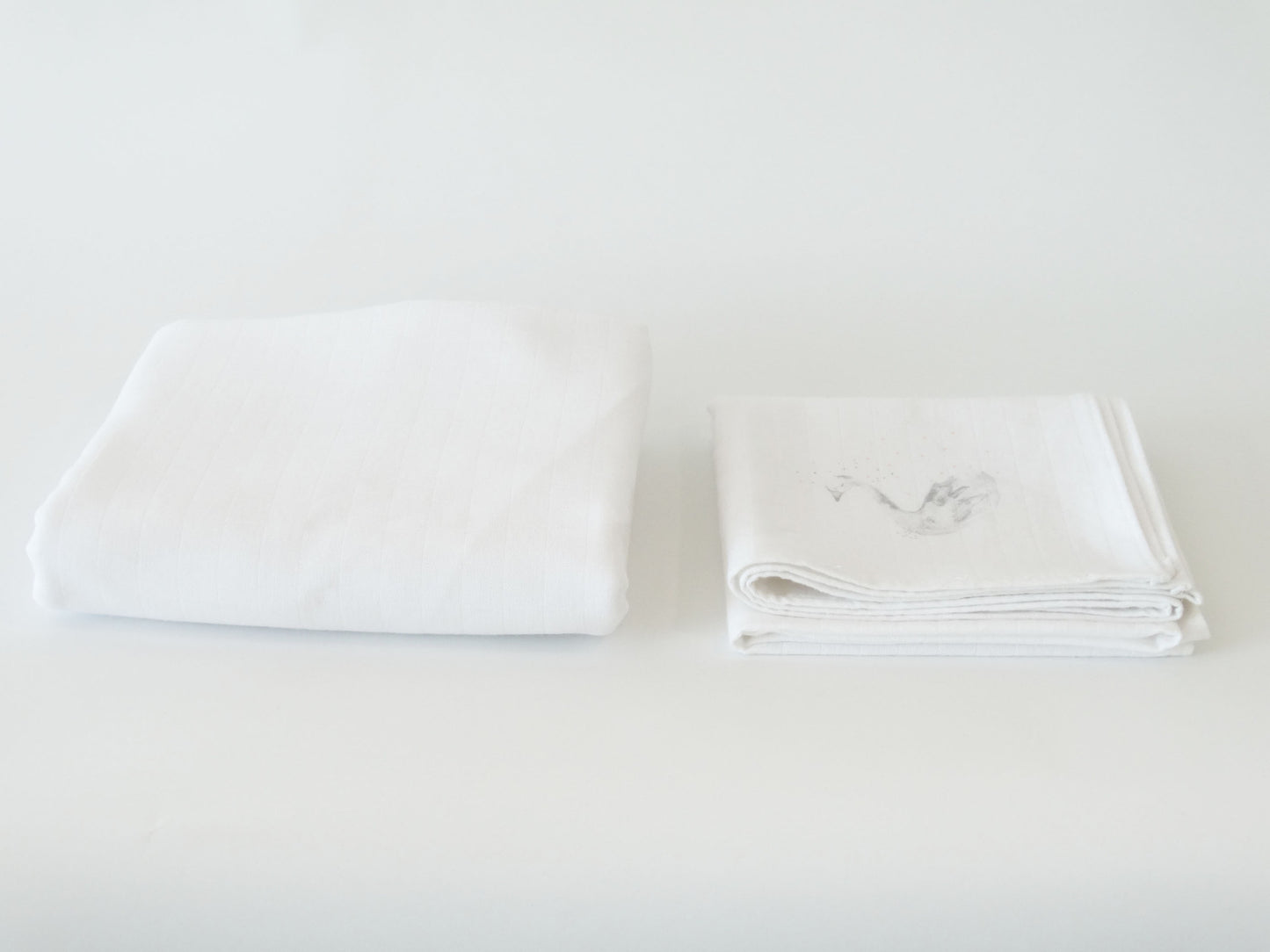 Nos essentiels : Le tissu lange lourd à carreaux uni blanc
